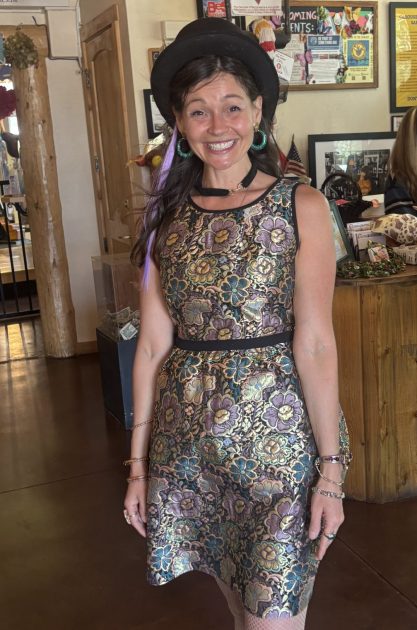 photo of assistant director, Sarah Bishop getting ready for the Carousel of Happiness Tea Party